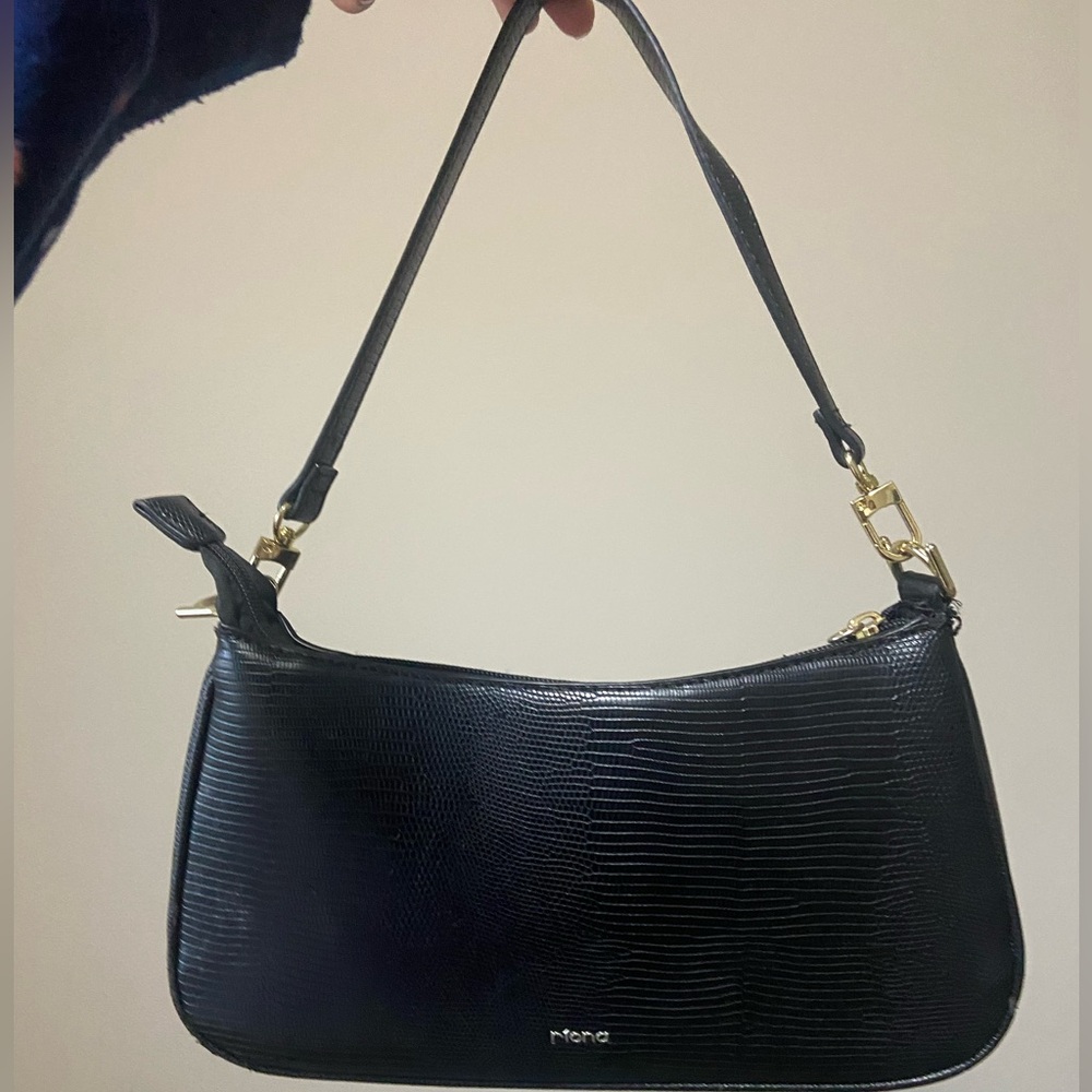 Black shoulder bag with gold detailing